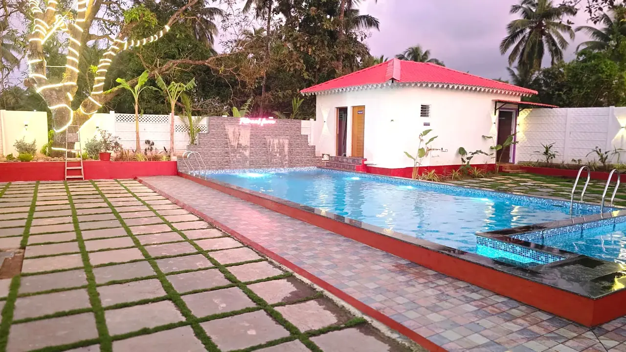 Fiternal Farm pool at dusk with hut